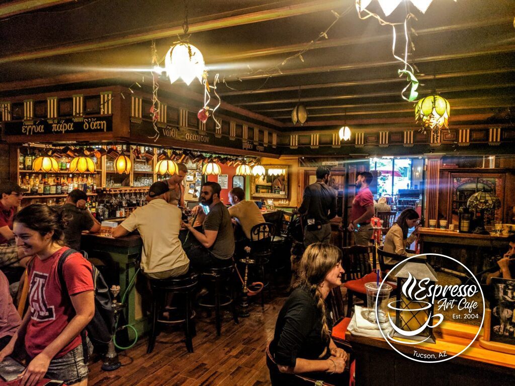 Inside Espresso Art Cafe in Tucson, with diverse patrons playing chess, enjoying coffee, and socializing in a vibrant, LGBTQ-friendly setting.
