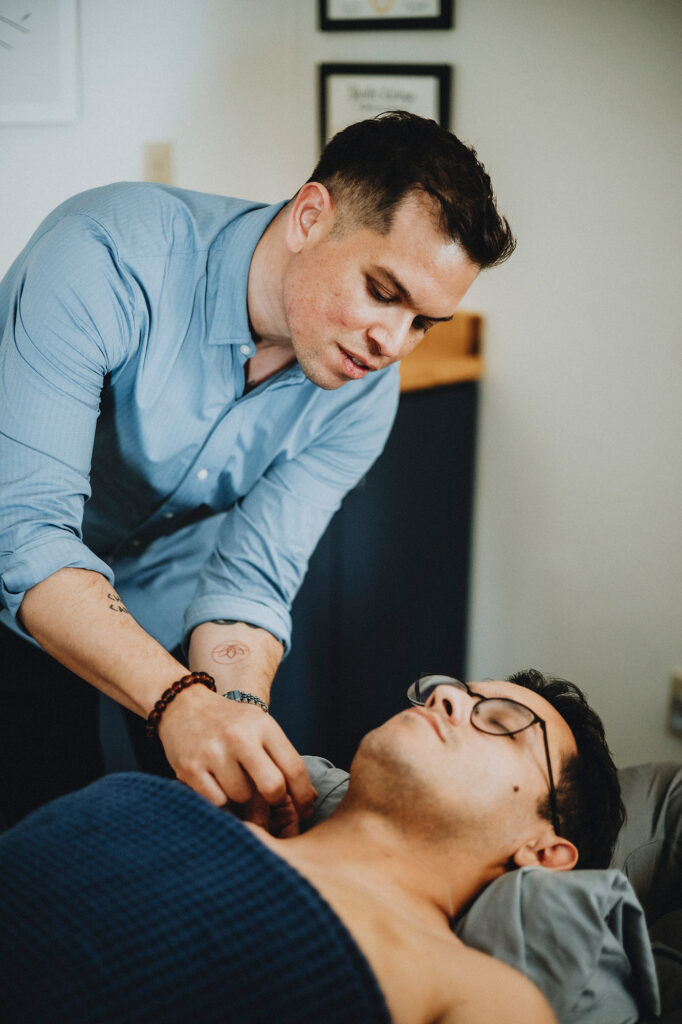 Practitioner providing bodywork or medical massage to a client at Soul Space