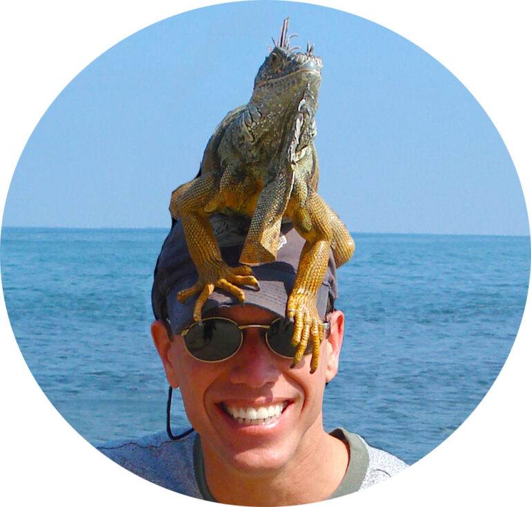 Image of Tony Ray Baker with an iguana on his head