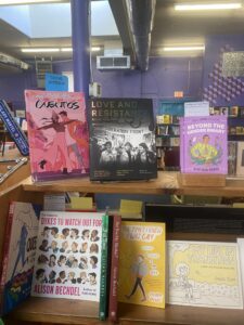 An array of books at Antigone Books in Tucson, highlighting LGBTQ and feminist themes.
