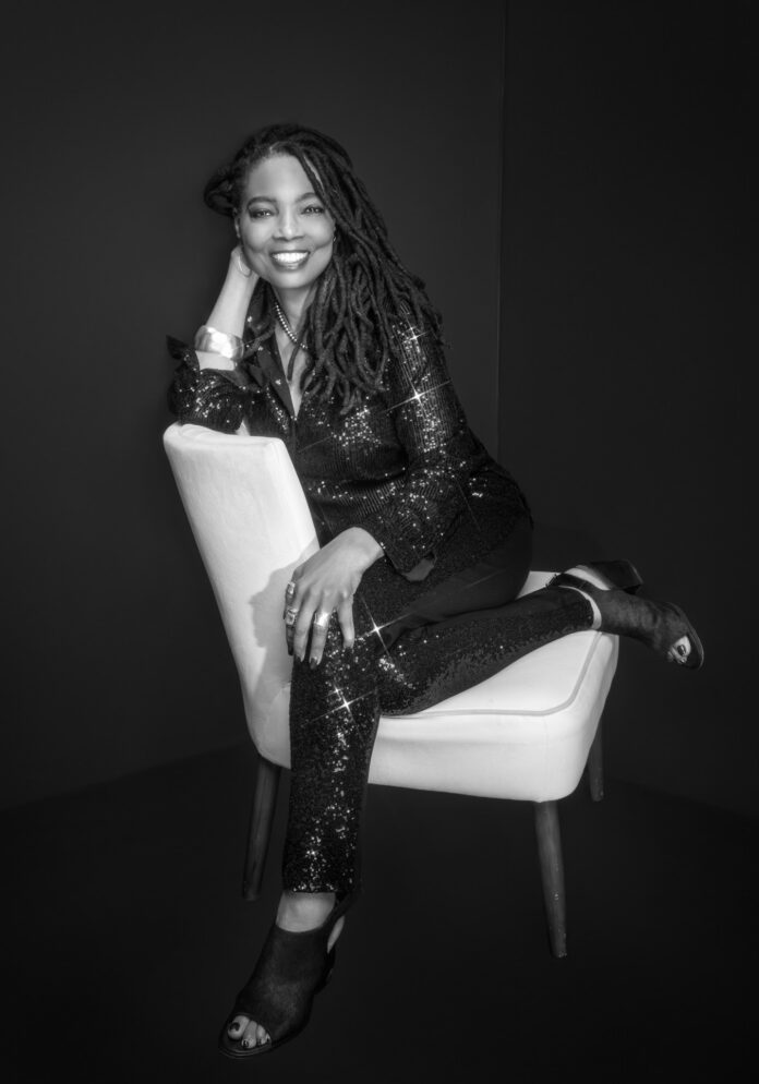 Kim Green – Blank Page Consulting Tucson Kim Green of Blank Page Consulting seated in a black-and-white portrait for her Tucson coaching and writing consulting business.